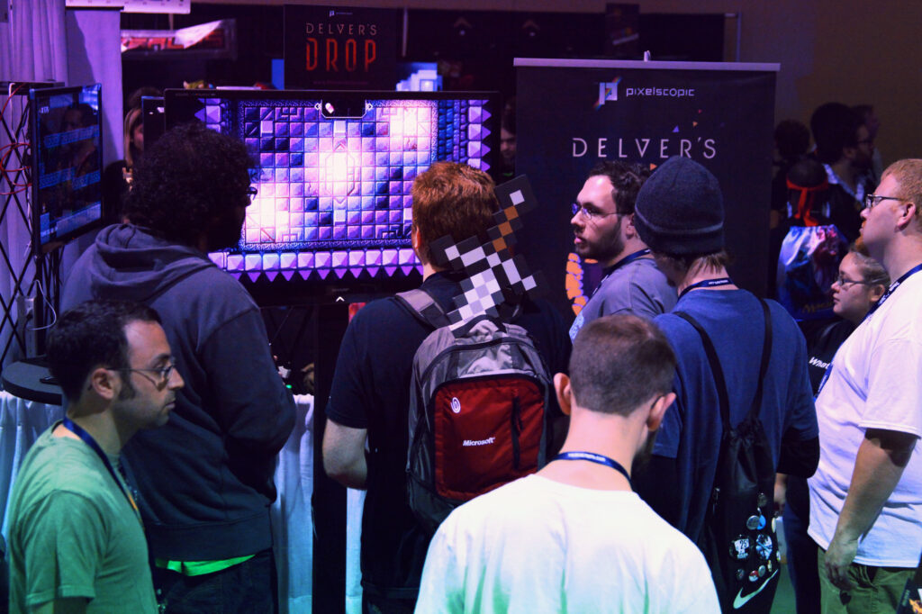 Gamers playing the demo of Delver's Drop at PAX Prime 2012